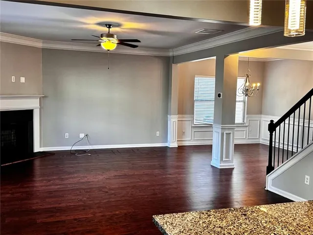 a view of a livingroom with wooden floor
