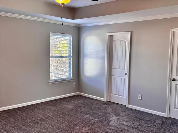 an empty room that has a window