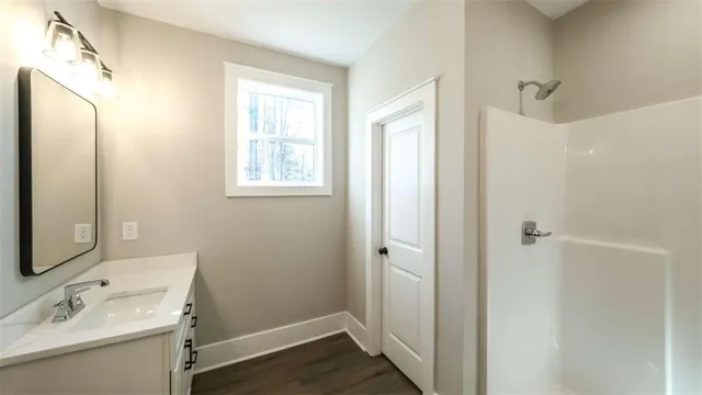 a bathroom with a sink and a mirror
