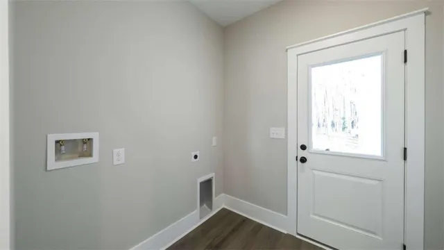 a view of front door with wooden floor
