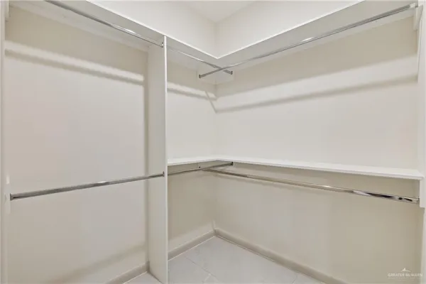 a view of an empty walk in closet