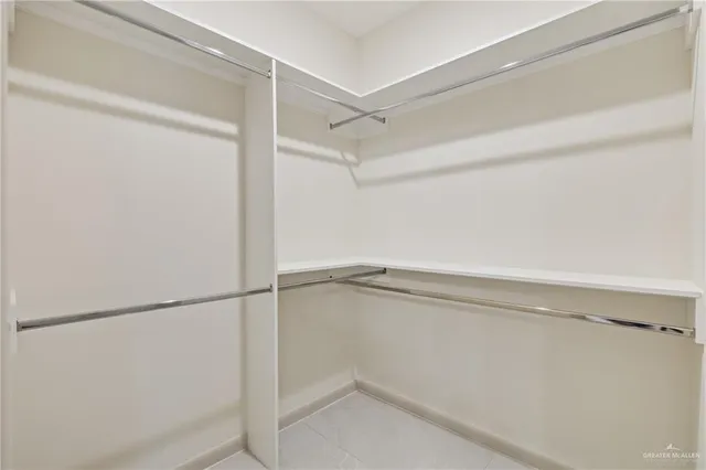 a view of an empty walk in closet