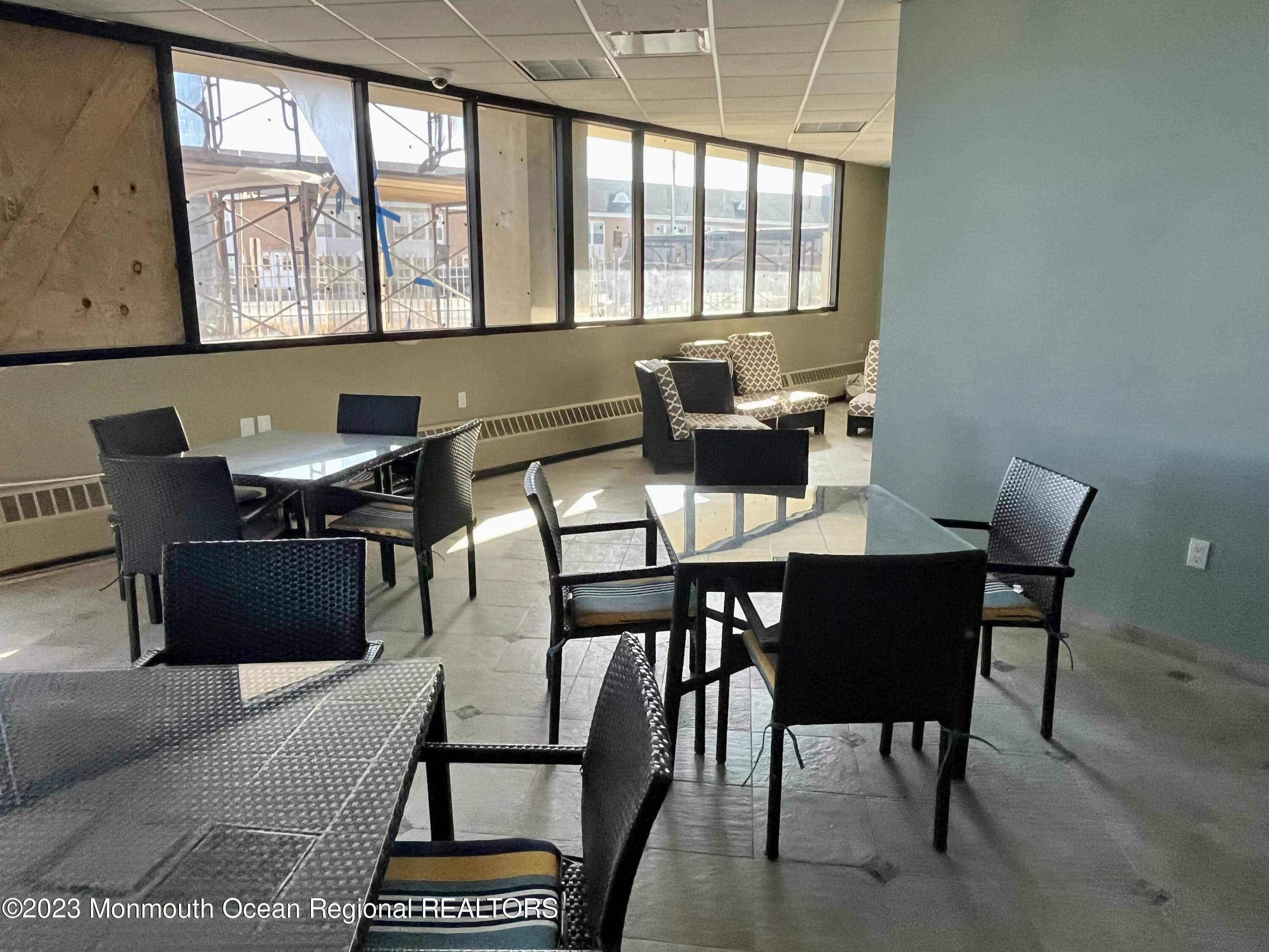 525 Ocean Boulevard, Unit 405 Long Branch, NJ 07740 - Photo 18 of 18 a view of a dining room with furniture and window
