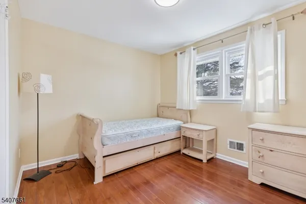 a bedroom with a bed and a table