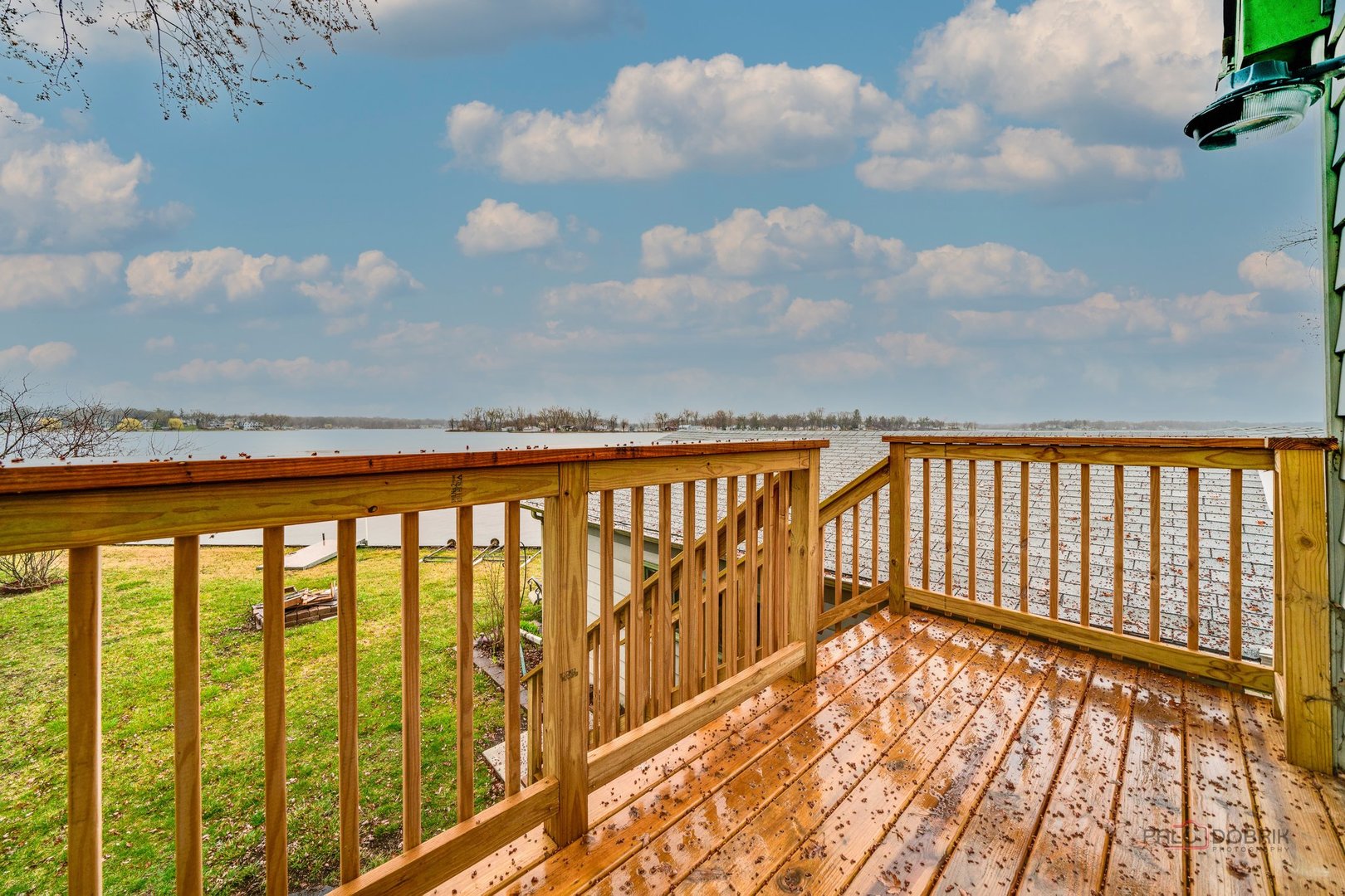 163 Eagle Point Road, Unit 2 Fox Lake, IL 60020 - Photo 11 of 38 a view of wooden balcony with a trees