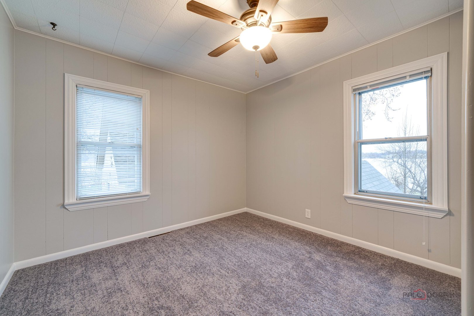 163 Eagle Point Road, Unit 2 Fox Lake, IL 60020 - Photo 17 of 38 an empty room with windows and fan