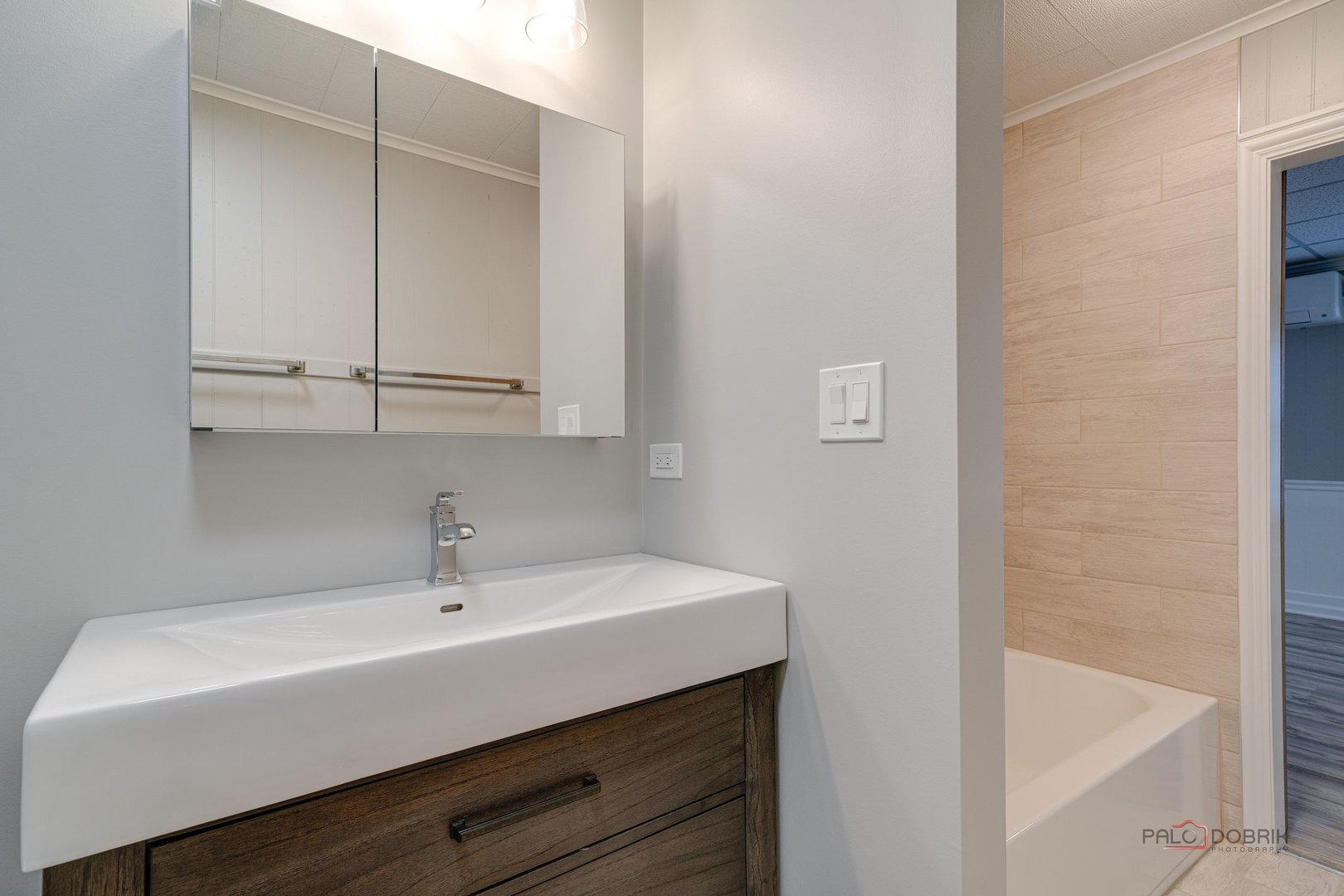 163 Eagle Point Road, Unit 2 Fox Lake, IL 60020 - Photo 19 of 38 a bathroom with a sink and a bathtub