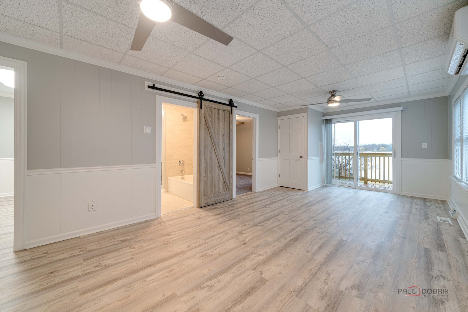 163 Eagle Point Road, Unit 2 Fox Lake, IL 60020 - Photo 5 of 38 wooden floor in an empty room with a window
