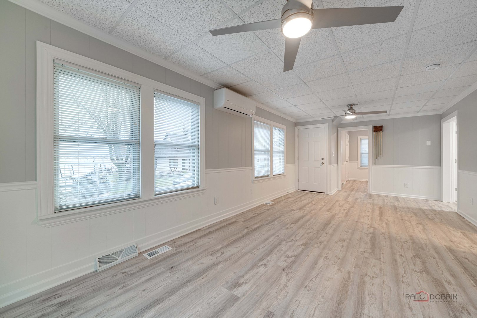 163 Eagle Point Road, Unit 2 Fox Lake, IL 60020 - Photo 8 of 38 a view of an empty room with wooden floor and a window