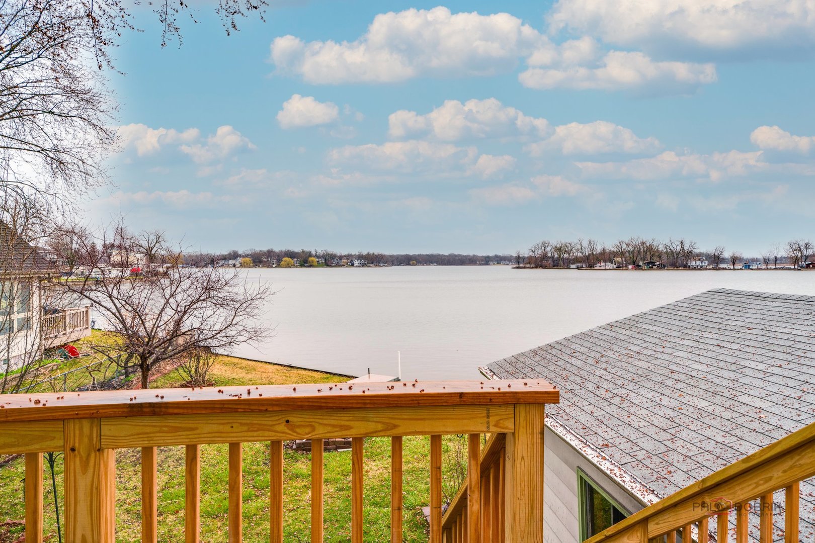 163 Eagle Point Road, Unit 2 Fox Lake, IL 60020 - Photo 10 of 38 a view of swimming pool with lake and trees in the background