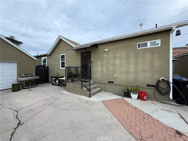 a view of barbeque area with seating area