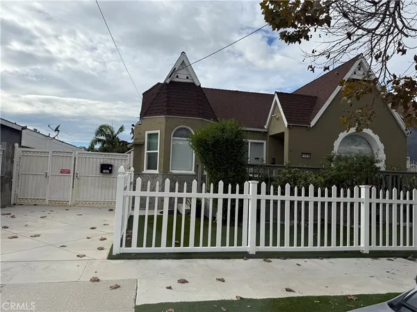 a living room with furniture a flat screen tv and gym equipment