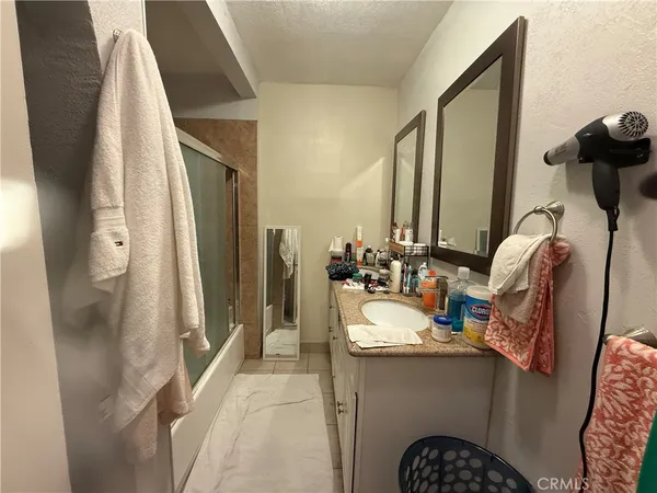 a bathroom with a toilet and a mirror