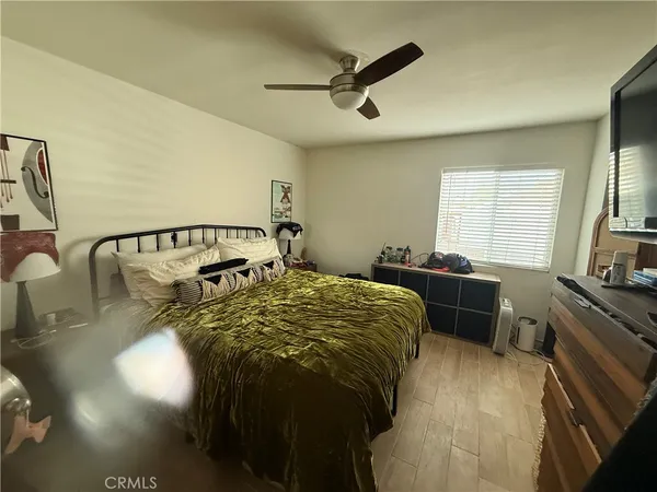 a living room with fireplace furniture and a wooden floor