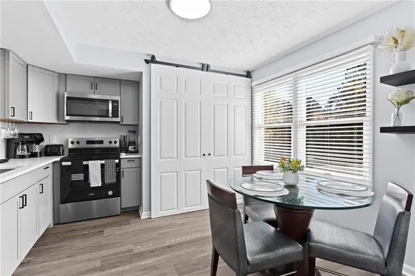 a kitchen with a stove a sink and a refrigerator