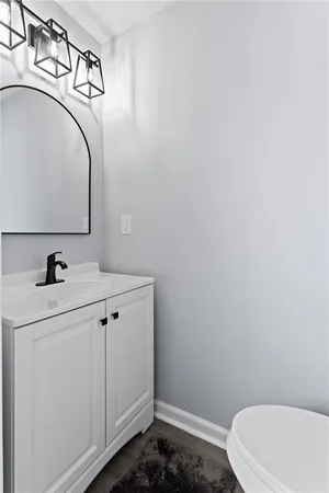 a bathroom with a sink and mirror