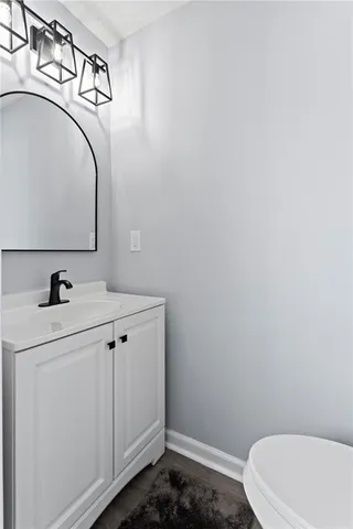 a bathroom with a sink and mirror