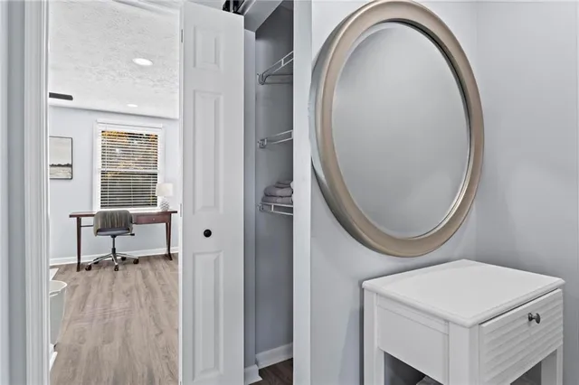 a bathroom with a toilet a sink and a mirror
