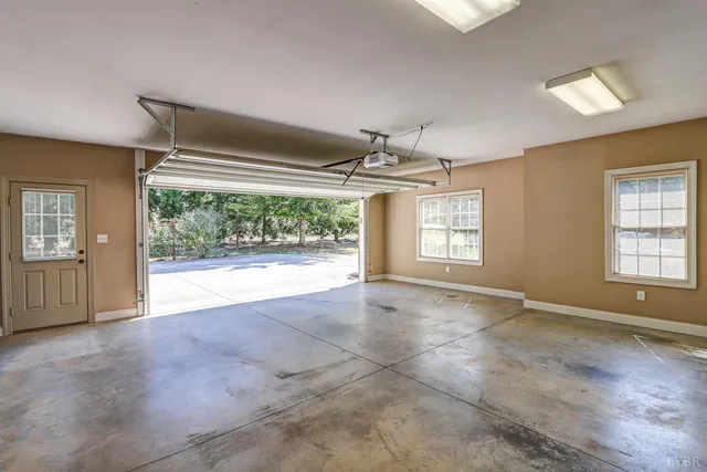 a view of empty room with wooden walls