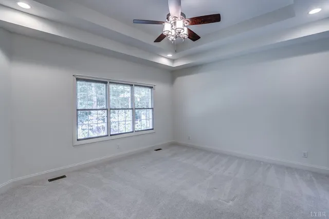 a view of room with window and furniture