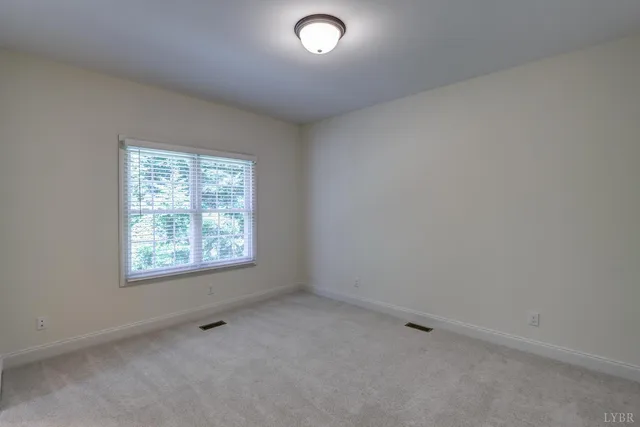 an aerial view of a house with swimming pool and garden view