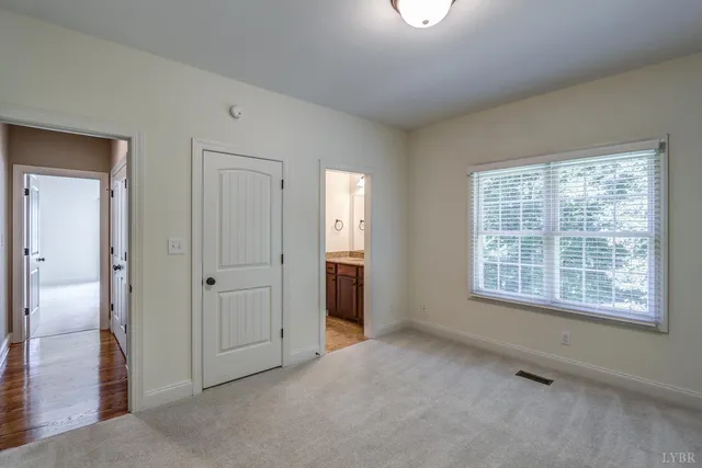 an aerial view of a house with a yard and garden