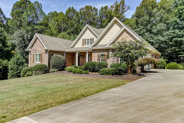 a view of a big room with wooden floor and chandelier