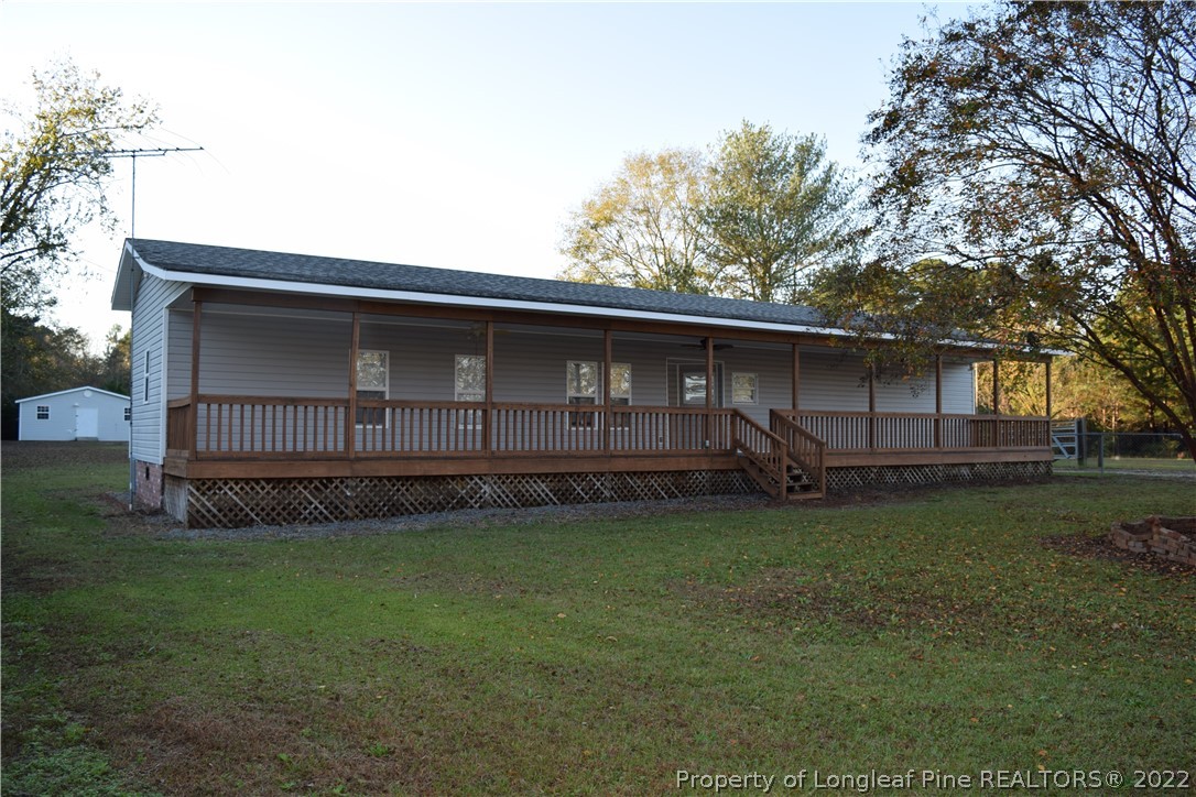 9524 Rockfish Road Raeford, NC 28376 - Photo 3 of 35 a front view of a house with garden