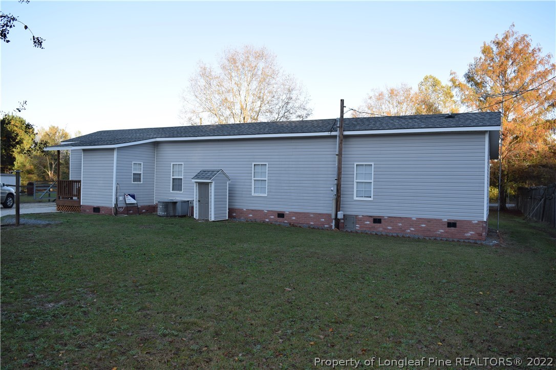 9524 Rockfish Road Raeford, NC 28376 - Photo 7 of 35 a front view of house with yard and trees