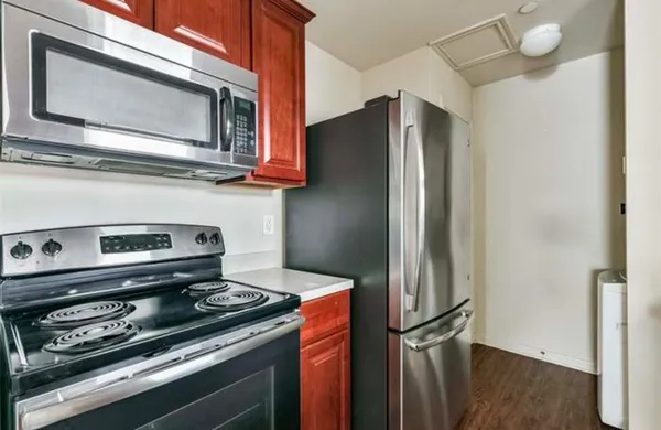 a kitchen with appliances and a microwave