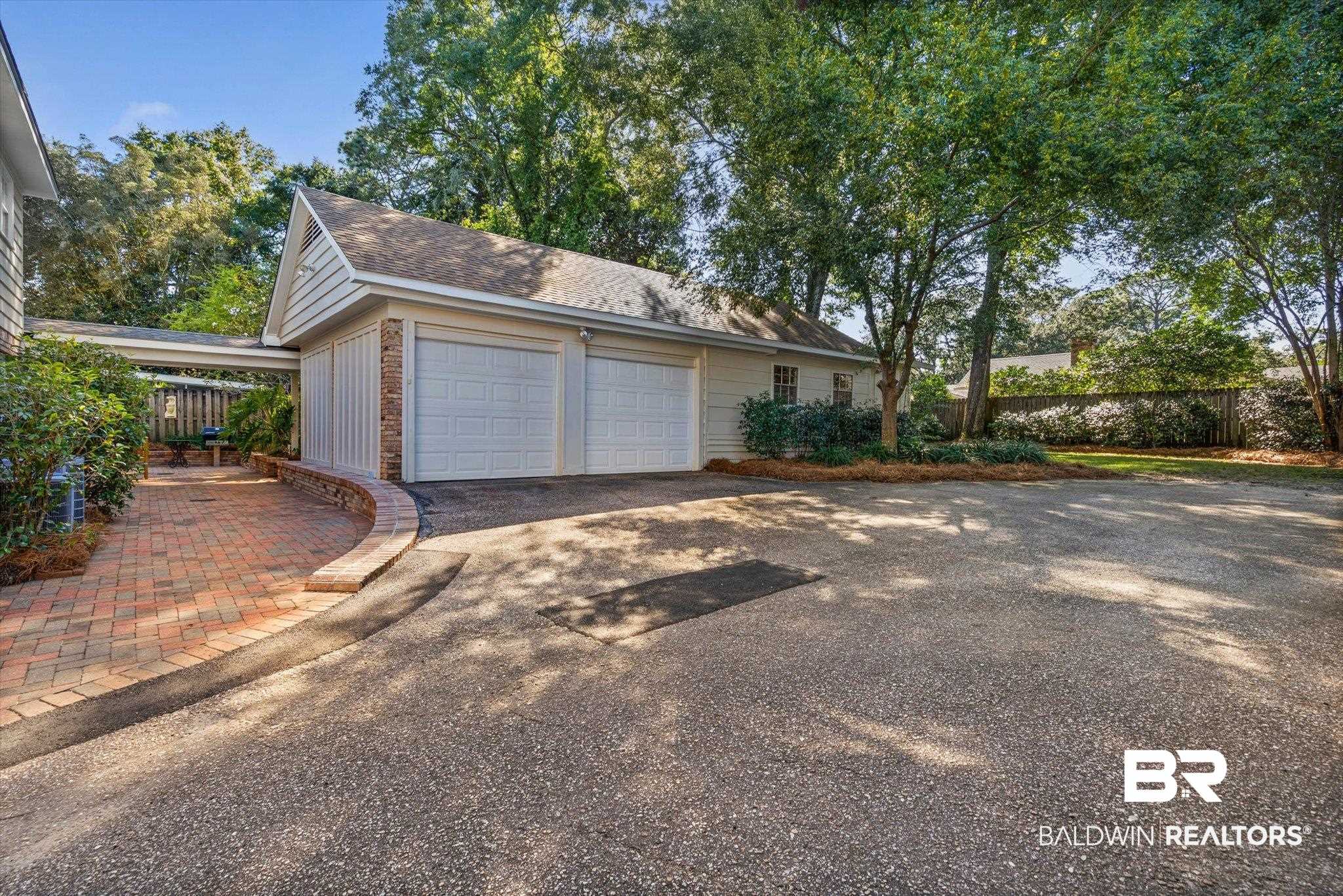 513 Spring Park Drive East Mobile, AL 36608 - Photo 38 of 44 Garage with driveway