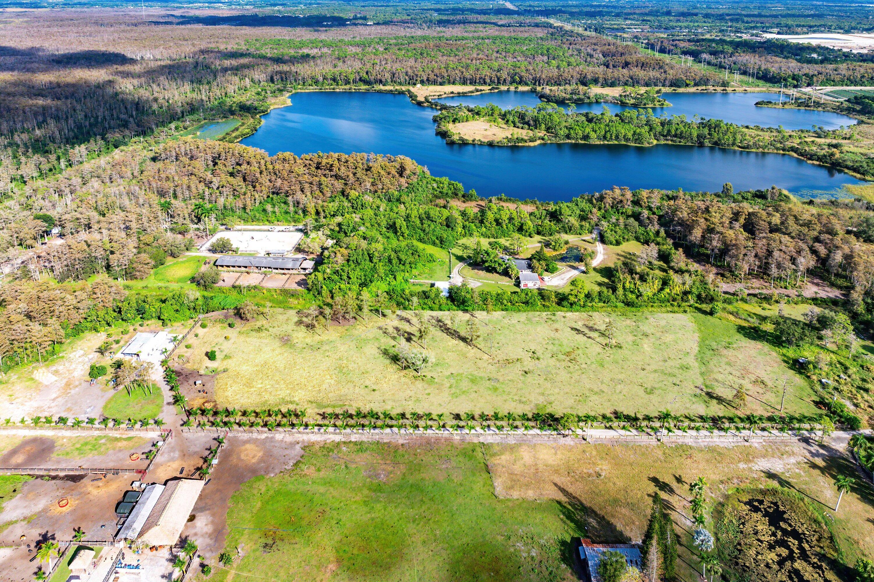 11511 Townsend Lane Boynton Beach, FL 33472 - Photo 4 of 21 a view of a lake with a mountain in the background