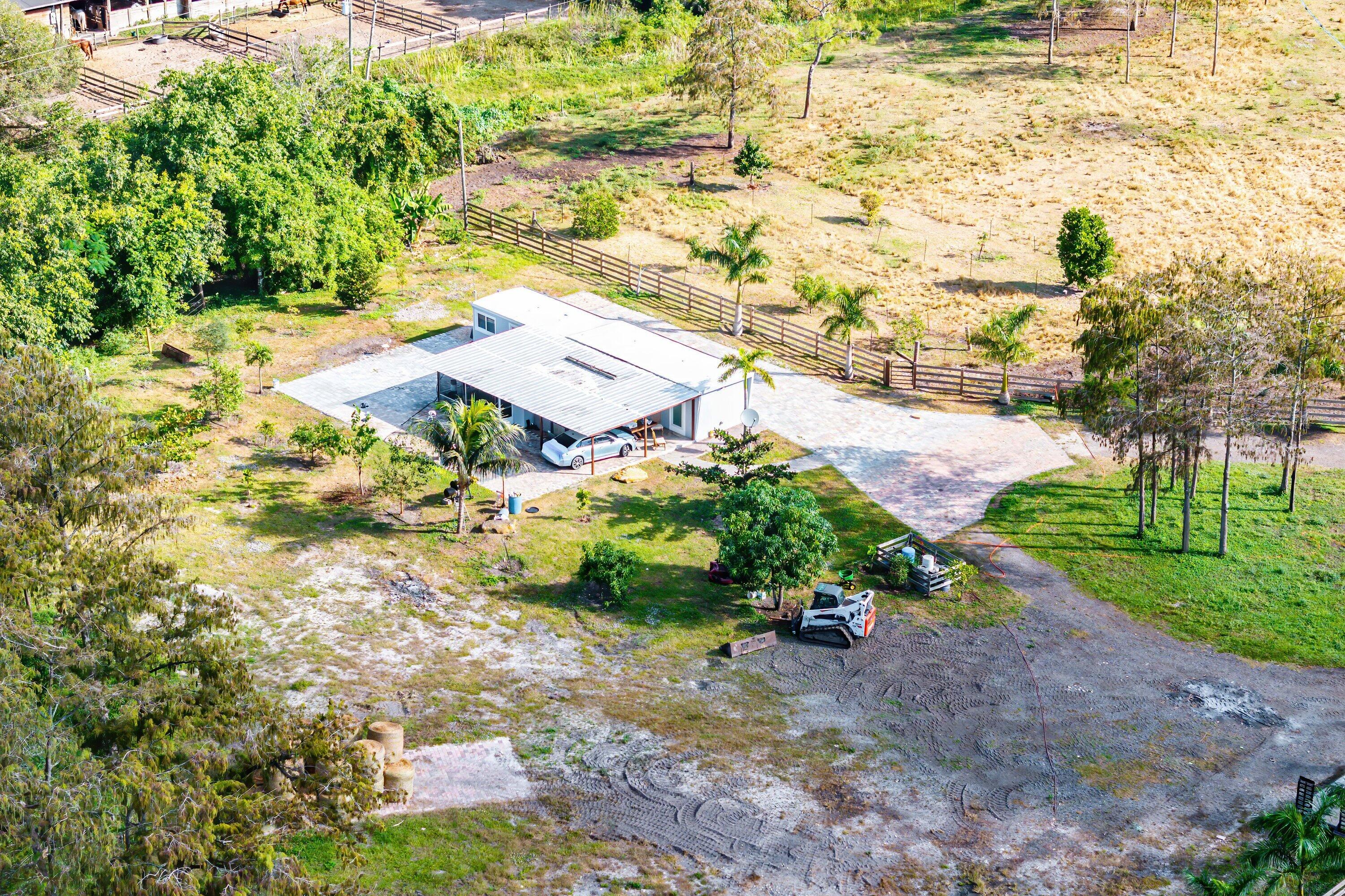 11511 Townsend Lane Boynton Beach, FL 33472 - Photo 6 of 21 a view of a yard with flower plants