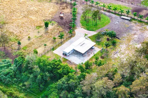 an aerial view of a house with a yard