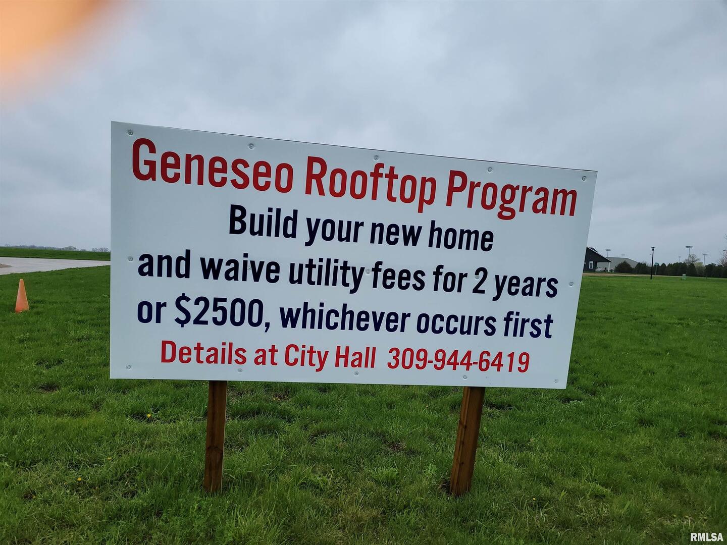 826 Book Lane Geneseo, IL 61254 - Photo 5 of 5 a sign is on the grass of the building