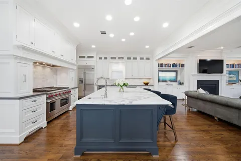 a bedroom with a large bed and a flat screen tv