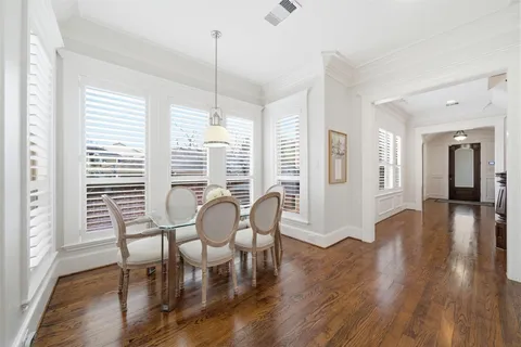 a spacious bathroom with a tub shower and windows