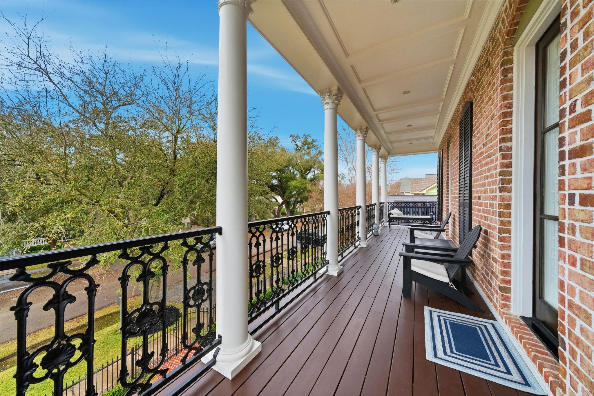 1418 Columbia Street Houston, TX 77008 - Photo 28 of 45 A charming front balcony just outside the secondary bedrooms overlooks the tree lined street, perfect for fresh air, morning coffee, or a quiet evening unwind.