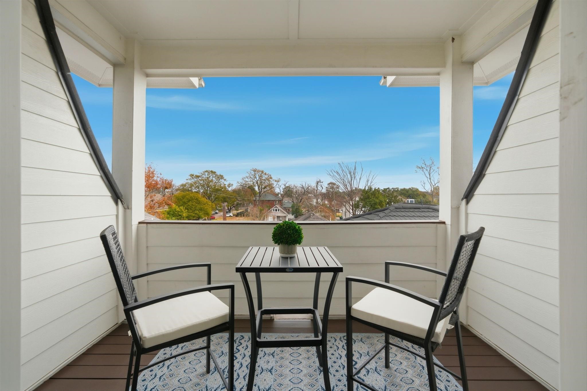 1418 Columbia Street Houston, TX 77008 - Photo 30 of 45 A private balcony off the third-floor suite faces east, an ideal space to catch the sunrise and enjoy peaceful neighborhood views above the treetops.