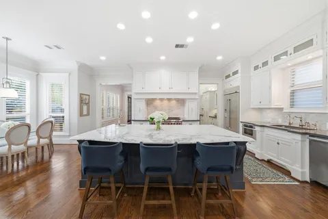 a living room with furniture a rug and a window