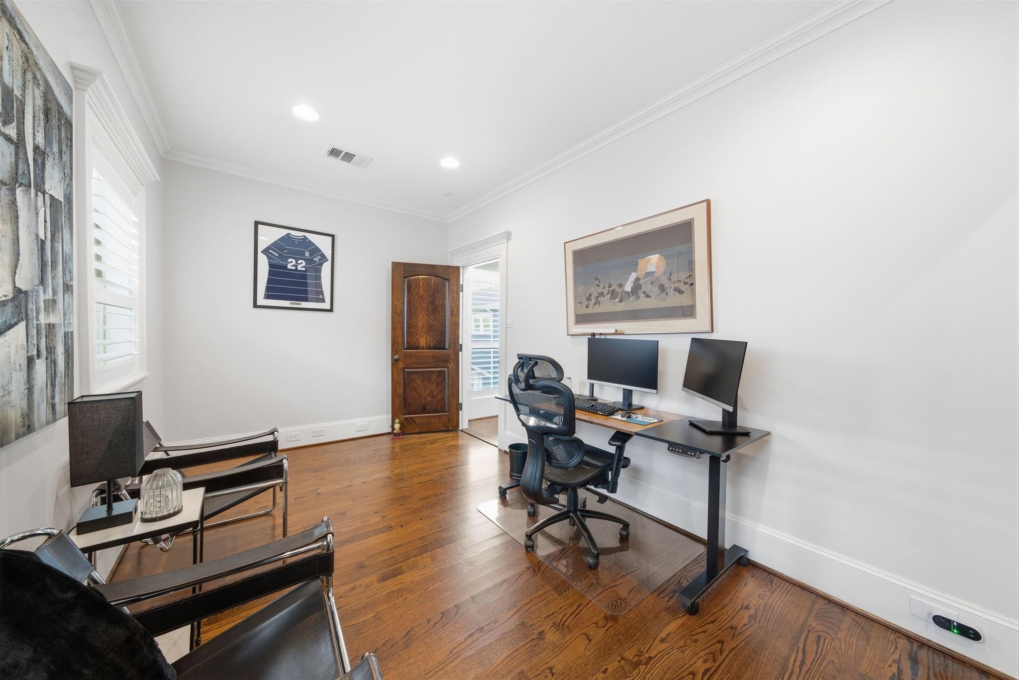 1418 Columbia Street Houston, TX 77008 - Photo 37 of 45 Just beyond the suite, a separate flex room currently serves as a second office and offers excellent separation for work, hobbies or additional living space.