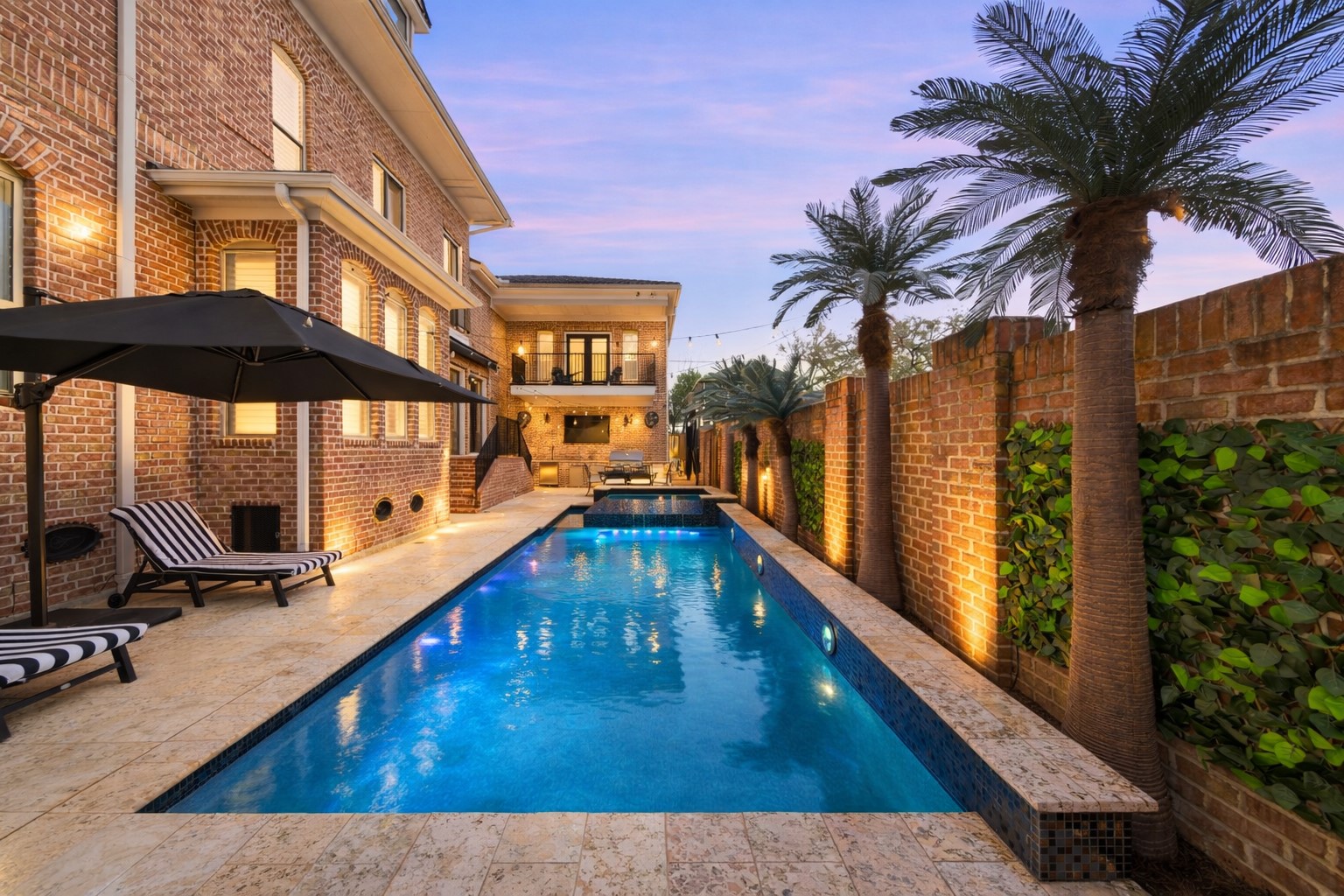 1418 Columbia Street Houston, TX 77008 - Photo 39 of 48 A heated pool and spa framed by low maintenance faux palms create an inviting, resort style backdrop for effortless evenings under the lights.