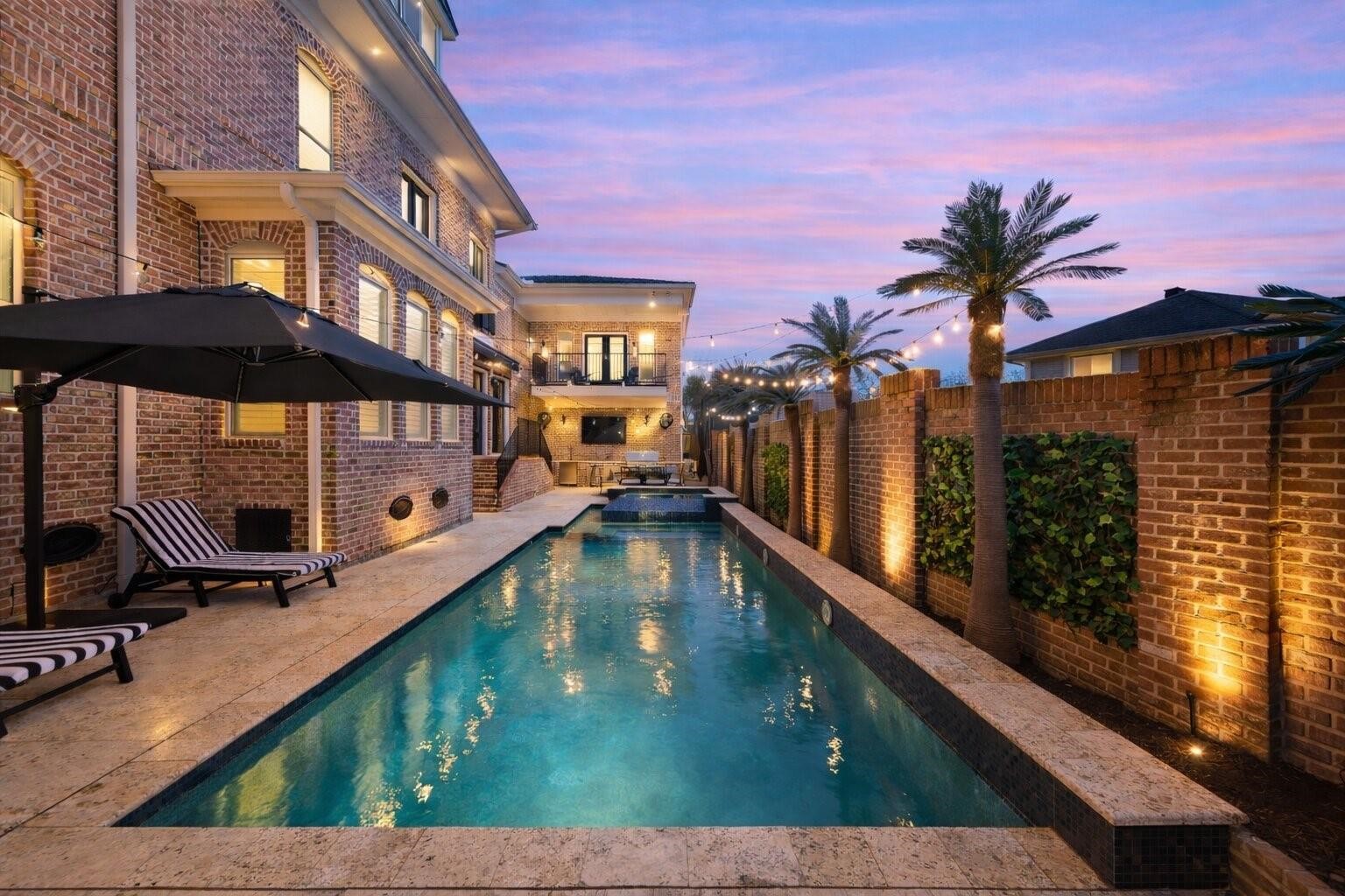 1418 Columbia Street Houston, TX 77008 - Photo 39 of 45 A heated pool and spa framed by low maintenance faux palms create an inviting, resort style backdrop for effortless evenings under the lights.