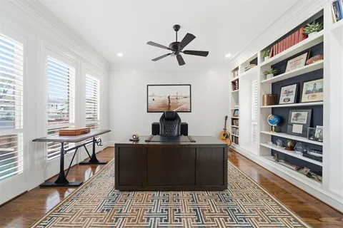 a kitchen with stainless steel appliances granite countertop a stove a sink and a wooden floors