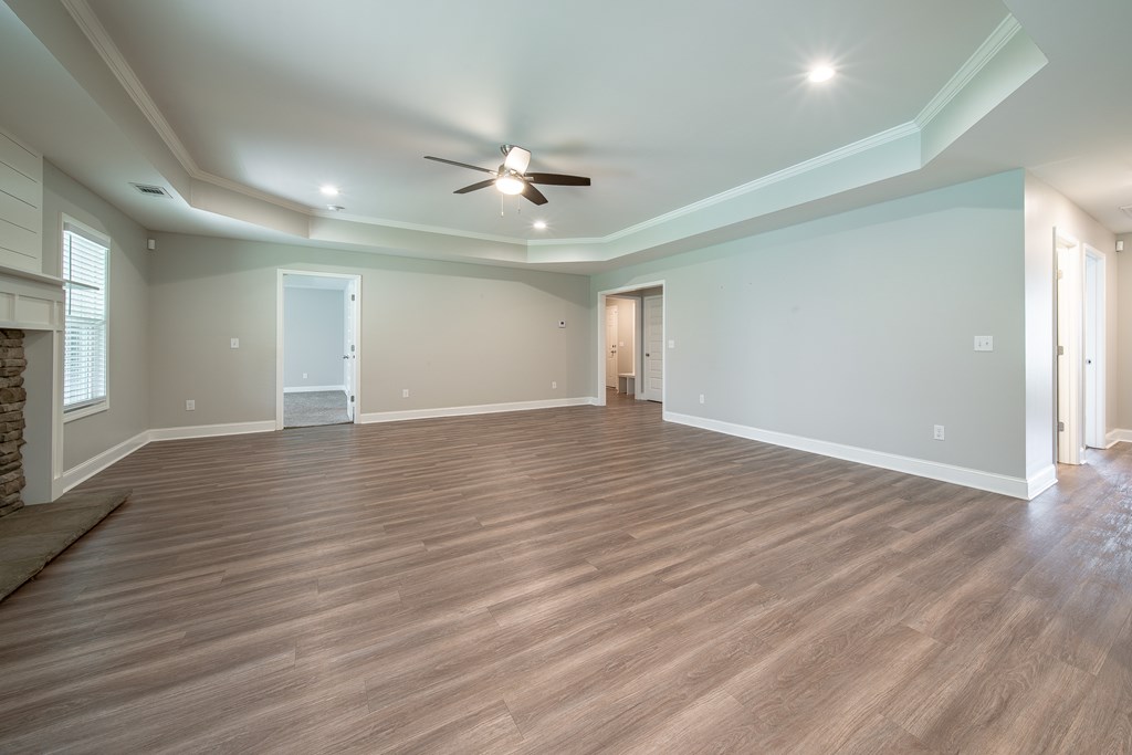 16 Maxwell Drive Fort Mitchell, AL 36856 - Photo 18 of 25 a view of an empty room with wooden floor and a window