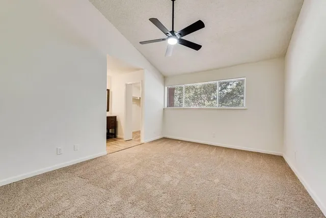 a view of an empty room with a window