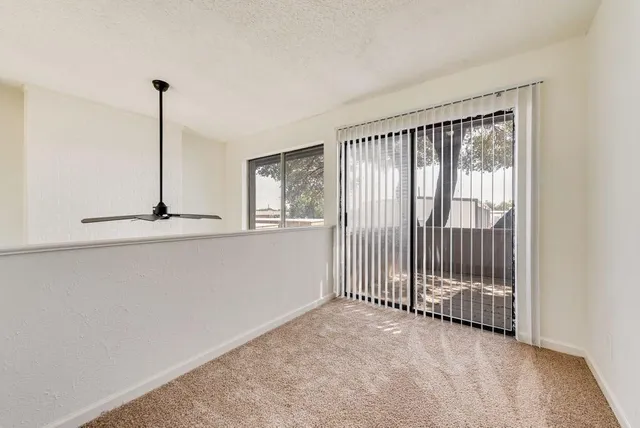 a view of empty room with floor to ceiling window