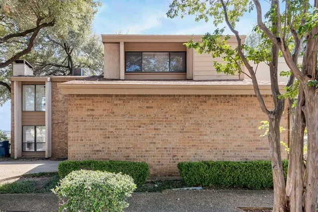 a front view of a house with yard