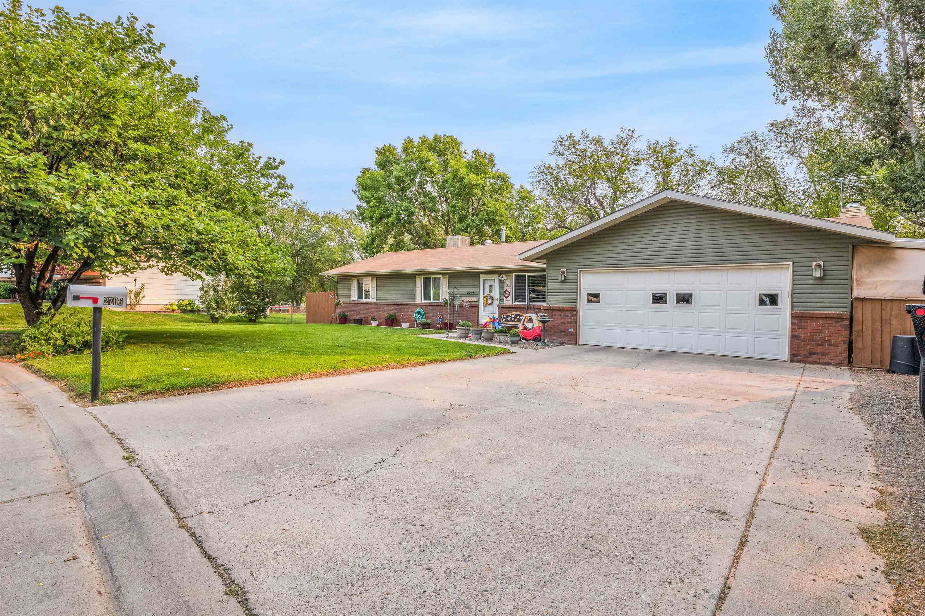 2706 Rincon Drive Grand Junction, CO 81503 - Photo 2 of 42 a front view of house with yard and green space