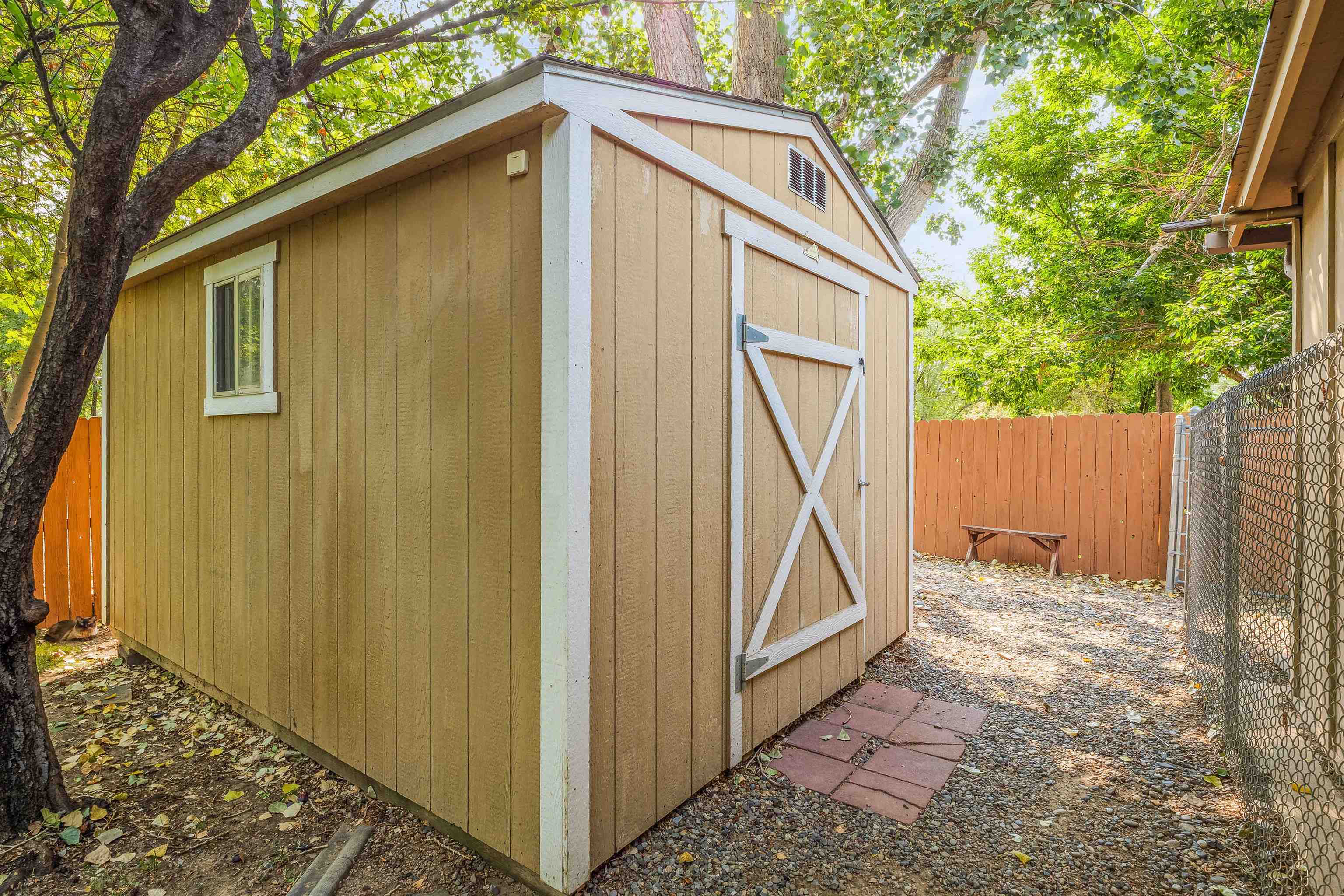 2706 Rincon Drive Grand Junction, CO 81503 - Photo 37 of 42 a backyard of a house with plants and wooden fence